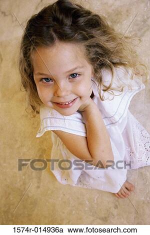 Stock Image - High angle view of a girl smiling. Fotosearch