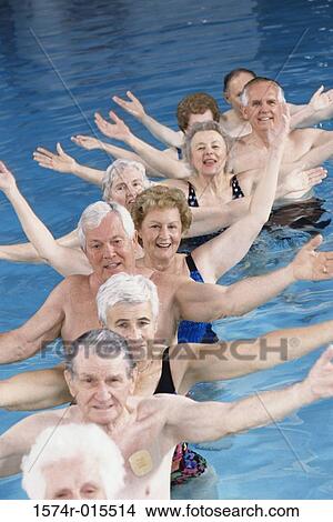 High angle view of a group of senior people performing water aerobics in a swimming pool View Large Photo Image Picture - High angle view of a group of senior people performing water aerobics in a swimming pool. Fotosearch