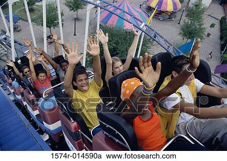 High angle view of a group of teenagers riding a rollercoaster View Large Photo Image Stock Image - High angle view of a group of teenagers riding a rollercoaster. Fotosearch
