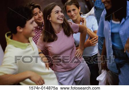 High angle view of a group of teenagers talking View Large Photo Image Stock Image - High angle view of a group of teenagers talking. Fotosearch