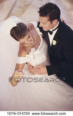 Picture - High angle view of a newlywed couple dancing. Fotosearch