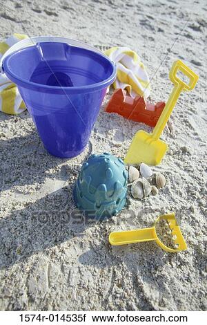 High angle view of a sand pail and a shovel on the beach View Large Photo Image Stock Image - High angle view of a sand pail and a shovel on the beach. Fotosearch