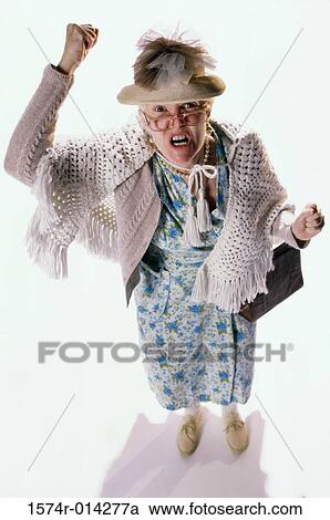High angle view of a senior woman shouting in anger View Large Photo Image Stock Image - High angle view of a senior woman shouting in anger. Fotosearch