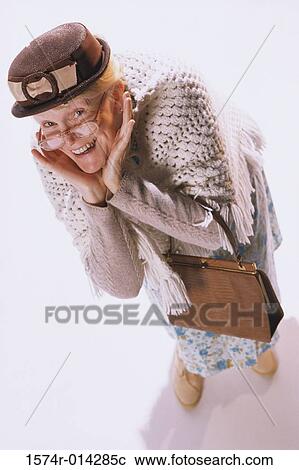 High angle view of a senior woman smiling View Large Photo Image Stock Image - High angle view of a senior woman smiling. Fotosearch