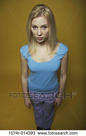 High angle view of a teenage girl looking serious View Large Photo Image Stock Image - High angle view of a teenage girl looking serious. Fotosearch