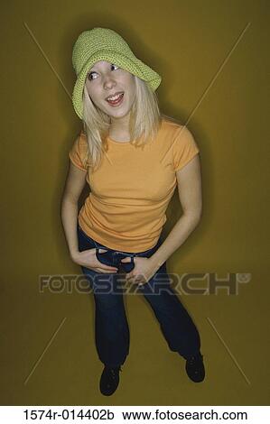 Stock Image - High angle view of a teenage girl smiling. Fotosearch