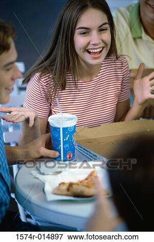 High angle view of a teenage girl smiling in a restaurant View Large Photo Image Stock Photo - High angle view of a teenage girl smiling in a restaurant. Fotosearch