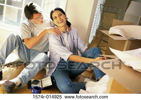 Stock Photography - High angle view of a young man massaging a young woman's shoulders. Fotosearch