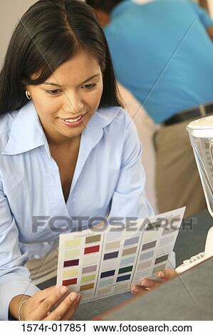 High angle view of a young woman choosing color from a color swatch View Large Photo Image Stock Image - High angle view of a young woman choosing color from a color swatch. Fotosearch