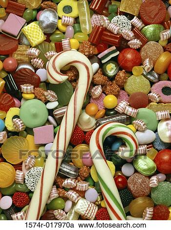 High angle view of candies with two candy canes View Large Photo Image Stock Image - High angle view of candies with two candy canes. Fotosearch