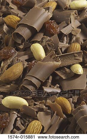 High angle view of chocolate shavings with raisins and peanuts View Large Photo Image Stock Image - High angle view of chocolate shavings with raisins and peanuts. Fotosearch