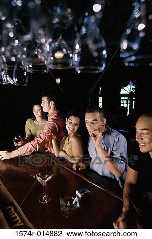 High angle view of five people at a bar View Large Photo Image Stock Image - High angle view of five people at a bar. Fotosearch