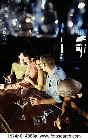 High angle view of five people at a bar View Large Photo Image Stock Image - High angle view of five people at a bar. Fotosearch