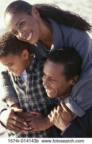High angle view of parents with their son View Large Photo Image Stock Image - High angle view of parents with their son. Fotosearch