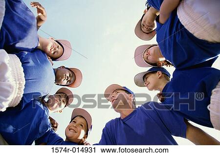 Low angle view of baseball players standing in a huddle with their coach View Large Photo Image Stock Image - Low angle view of baseball players standing in a huddle with their coach. Fotosearch