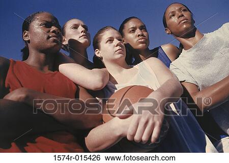 Low angle view of five teenage girls standing together View Large Photo Image Stock Photograph - Low angle view of five teenage girls standing together. Fotosearch
