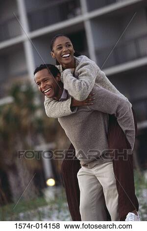 Mature woman riding piggyback on a mature man View Large Photo Image Stock Photo - Mature woman riding piggyback on a mature man. Fotosearch