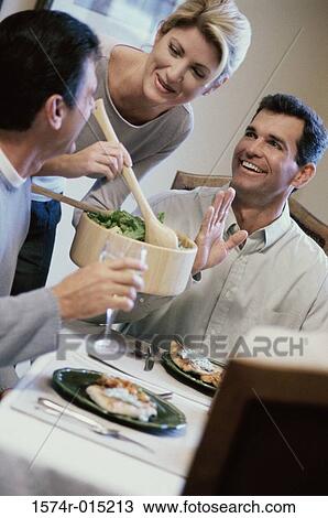 Midi adult woman serving salad View Large Photo Image Stock Image - Midi adult woman serving salad. Fotosearch