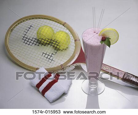 Stock Image - Milkshake and a tennis racket with two tennis balls. Fotosearch