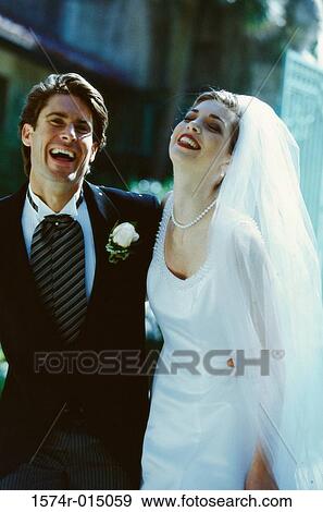 Newlywed couple laughing View Large Photo Image Stock Photo - Newlywed couple laughing. Fotosearch