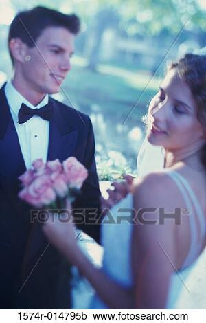 Newlywed couple looking at each other View Large Photo Image Stock Image - Newlywed couple looking at each other. Fotosearch