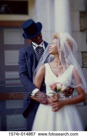 Newlywed couple looking at each other View Large Photo Image Stock Photo - Newlywed couple looking at each other. Fotosearch