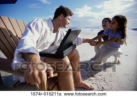 Parents and their daughter playing on the beach View Large Photo Image Stock Image - Parents and their daughter playing on the beach. Fotosearch