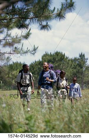 Parents hiking with their son and daughter View Large Photo Image Stock Image - Parents hiking with their son and daughter. Fotosearch