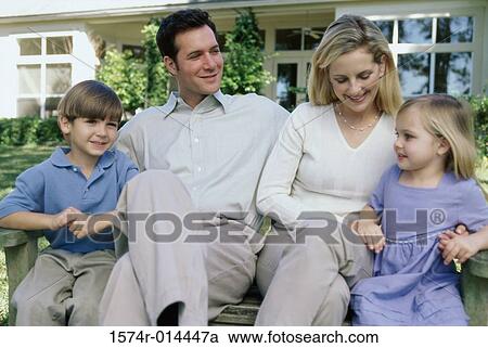 Parents sitting with their son and daughter View Large Photo Image Stock Image - Parents sitting with their son and daughter. Fotosearch