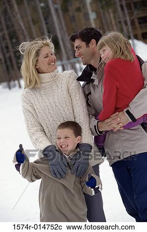 Parents standing with their son and daughter View Large Photo Image Stock Image - Parents standing with their son and daughter. Fotosearch