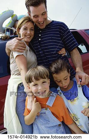 Parents standing with their son and daughter View Large Photo Image Stock Image - Parents standing with their son and daughter. Fotosearch