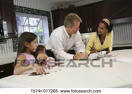 Parents standing with their two daughters View Large Photo Image Stock Photography - Parents standing with their two daughters. Fotosearch