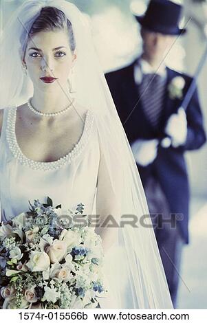 Portrait of a bride holding a bouquet View Large Photo Image Stock Image - Portrait of a bride holding a bouquet. Fotosearch