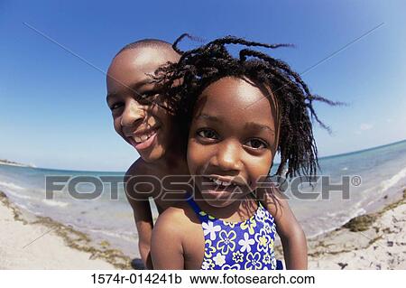 Portrait of a brother and his sister smiling View Large Photo Image Stock Image - Portrait of a brother and his sister smiling. Fotosearch