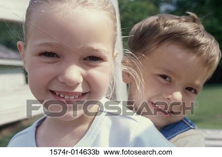 Portrait of a brother and sister smiling View Large Photo Image Stock Image - Portrait of a brother and sister smiling. Fotosearch