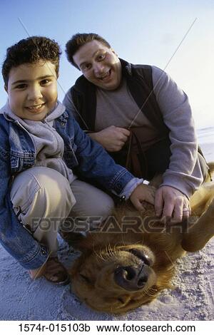 Portrait of a father and son with their dog View Large Photo Image Stock Image - Portrait of a father and son with their dog. Fotosearch