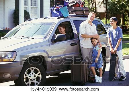 Portrait of a father standing with his son and daughter beside a car View Large Photo Image Stock Photo - Portrait of a father standing with his son and daughter beside a car. Fotosearch
