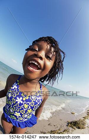 Portrait of a girl laughing on the beach View Large Photo Image Stock Photo - Portrait of a girl laughing on the beach. Fotosearch