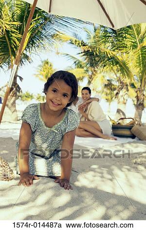 Portrait of a girl smiling on the beach View Large Photo Image Stock Image - Portrait of a girl smiling on the beach. Fotosearch