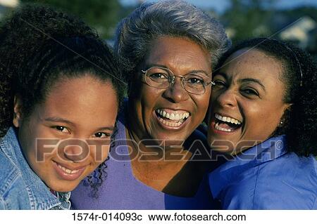 Portrait of a grandmother smiling with her daughter and granddaughter View Large Photo Image Stock Image - Portrait of a grandmother smiling with her daughter and granddaughter. Fotosearch