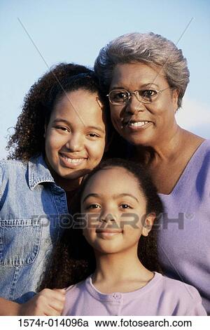 Portrait of a grandmother with her two granddaughters View Large Photo Image Stock Image - Portrait of a grandmother with her two granddaughters. Fotosearch