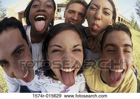 Portrait of a group of teenagers sticking out their tongues View Large Photo Image Stock Photo - Portrait of a group of teenagers sticking out their tongues. Fotosearch