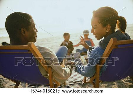 Stock Image - Portrait of a group of young people on the beach. Fotosearch