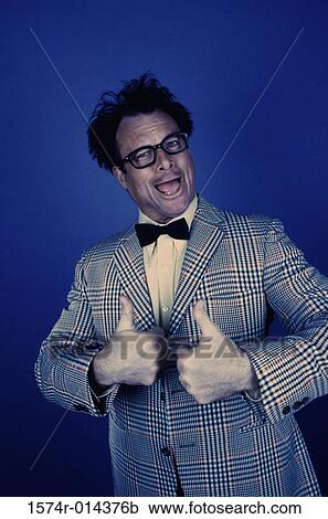 Stock Image - Portrait of a mid adult man showing a thumbs up sign. Fotosearch