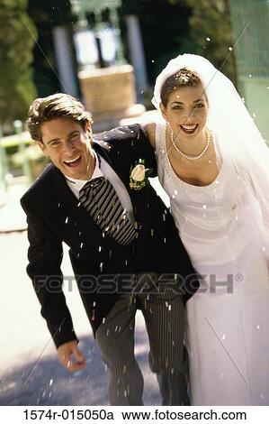 Portrait of a newlywed couple laughing View Large Photo Image Stock Image - Portrait of a newlywed couple laughing. Fotosearch