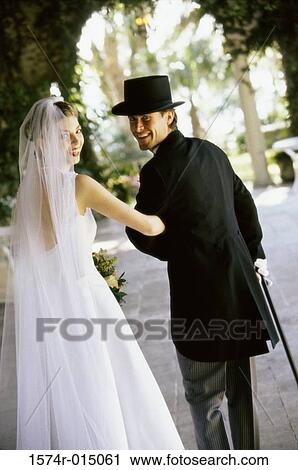 Portrait of a newlywed couple smiling View Large Photo Image Stock Image - Portrait of a newlywed couple smiling. Fotosearch
