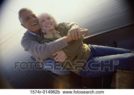Stock Image - Portrait of a senior couple embracing each other. Fotosearch