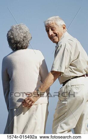 Portrait of a senior man flirting with a senior woman View Large Photo Image Stock Image - Portrait of a senior man flirting with a senior woman. Fotosearch