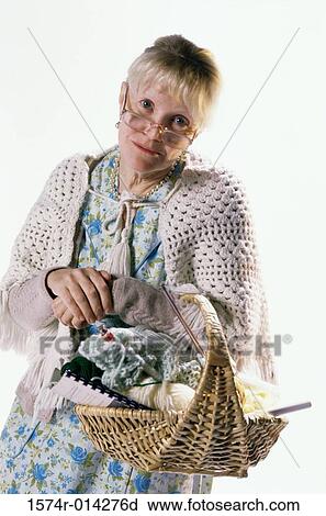 Portrait of a senior woman carrying a basket View Large Photo Image Stock Image - Portrait of a senior woman carrying a basket. Fotosearch