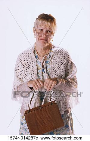 Stock Image - Portrait of a senior woman crying. Fotosearch